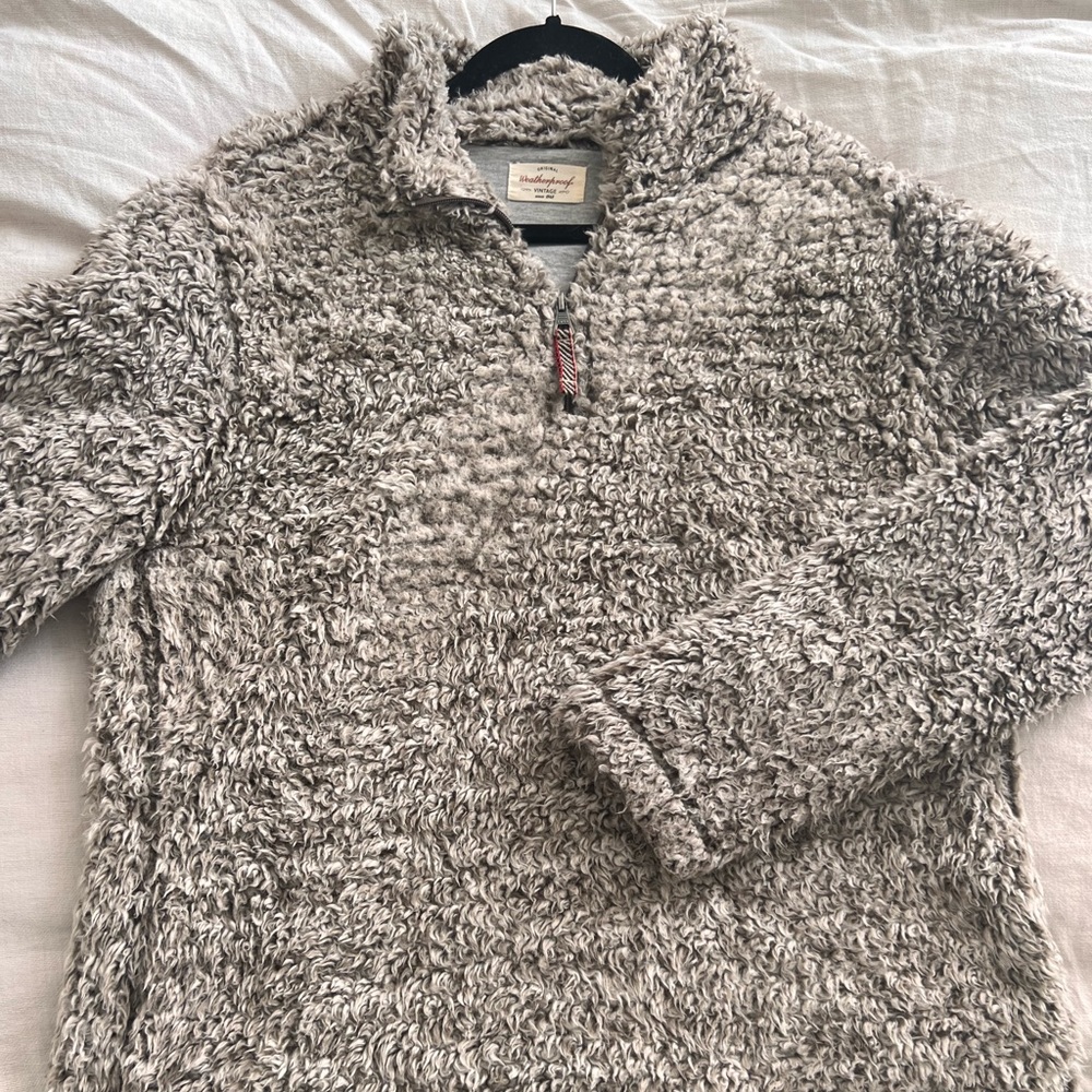 Sherpa teddy 1/4 zip with grey sweatshirt lining.